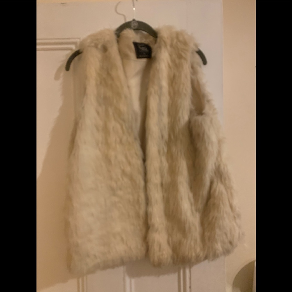 Creamish colored vest